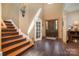 Bright entryway with hardwood floors, fireplace, and staircase at 1140 Fern Hill Rd, Mooresville, NC 28117