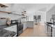 Modern kitchen with white cabinets, granite countertops and open shelving at 4194 Pointe Norman Dr, Sherrills Ford, NC 28673