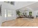 Bright living room with hardwood floors, neutral decor, and large windows at 4194 Pointe Norman Dr, Sherrills Ford, NC 28673