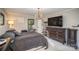 Main bedroom with large TV, dresser, and window views at 681 Pine Bluff Cir, Kannapolis, NC 28081