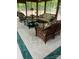 Bright sunroom with wicker furniture and large windows offering scenic views at 681 Pine Bluff Cir, Kannapolis, NC 28081