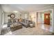 Spacious living room with a large sectional sofa and entry to hallway at 681 Pine Bluff Cir, Kannapolis, NC 28081