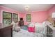 Charming bedroom with pink walls, a comfortable bed, and plenty of natural light at 681 Pine Bluff Cir, Kannapolis, NC 28081