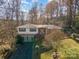 Two-story home with a two car garage and mature trees at 681 Pine Bluff Cir, Kannapolis, NC 28081