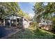 Ranch-style home with a sunroom and wooded backyard at 681 Pine Bluff Cir, Kannapolis, NC 28081