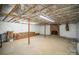 Unfinished basement with brick fireplace and plenty of storage space at 681 Pine Bluff Cir, Kannapolis, NC 28081
