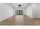 Spacious bedroom with hardwood floors and sliding glass doors to a deck at 13702 Sage Thrasher Ln, Charlotte, NC 28278