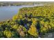 Lakefront property with home situated on a wooded lot at 13702 Sage Thrasher Ln, Charlotte, NC 28278