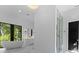 Spa-like bathroom with soaking tub and walk-in shower at 13702 Sage Thrasher Ln, Charlotte, NC 28278