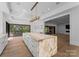 Gourmet kitchen with large island, white cabinets, and high-end appliances at 13702 Sage Thrasher Ln, Charlotte, NC 28278