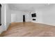 Large living room featuring hardwood floors and a modern fireplace at 13702 Sage Thrasher Ln, Charlotte, NC 28278