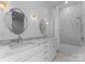 Elegant bathroom with marble shower, double vanity, and updated fixtures at 13702 Sage Thrasher Ln, Charlotte, NC 28278
