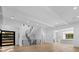Bright entryway with hardwood floors and a modern staircase at 13702 Sage Thrasher Ln, Charlotte, NC 28278