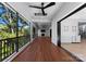 Screened porch with wood decking, fireplace, and wooded views at 13702 Sage Thrasher Ln, Charlotte, NC 28278