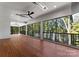 Spacious screened porch overlooking tranquil lake views at 13702 Sage Thrasher Ln, Charlotte, NC 28278