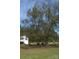 Mature tree and landscaping highlight the spacious backyard at 417 W Perry St, Heath Springs, SC 29058