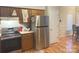 Stainless steel refrigerator and wood cabinetry in kitchen at 2015 David Earl Dr, Charlotte, NC 28213