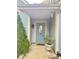 Front entry with a light blue door and potted plants at 2015 David Earl Dr, Charlotte, NC 28213