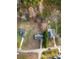Aerial view showcasing three houses with yards, a pool, and surrounding trees at 418 Summer Ridge Rd, Stanley, NC 28164