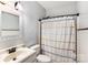 Clean bathroom with shower/tub combo, vanity, and updated fixtures at 418 Summer Ridge Rd, Stanley, NC 28164