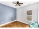 Bedroom with gray and white walls, hardwood floor and window at 418 Summer Ridge Rd, Stanley, NC 28164