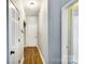Bright hallway with wood flooring and access to other rooms at 418 Summer Ridge Rd, Stanley, NC 28164