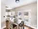 Kitchen with white cabinets, stainless steel appliances and backyard access at 418 Summer Ridge Rd, Stanley, NC 28164