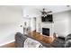 Living room featuring a fireplace, hardwood floors, and a ceiling fan at 418 Summer Ridge Rd, Stanley, NC 28164
