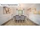 Elegant dining room with hardwood floors, neutral decor, and chandelier at 5090 Silver Creek Ln, Denver, NC 28037