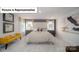 Main bedroom with king-size bed, grey walls, and large windows at 5090 Silver Creek Ln, Denver, NC 28037