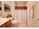 Bathroom with shower, toilet and wood vanity at 104 Aberdeen Dr, Troutman, NC 28166