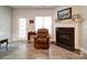 Relaxing living room with a fireplace and comfortable seating at 104 Aberdeen Dr, Troutman, NC 28166