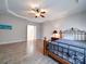 Spacious bedroom with wood flooring, ceiling fan and access to bathroom at 104 Aberdeen Dr, Troutman, NC 28166