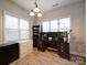 Spacious home office with large windows, a desk, and ample storage at 104 Aberdeen Dr, Troutman, NC 28166