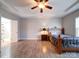 Spacious bedroom with wood floors and en-suite bathroom access at 104 Aberdeen Dr, Troutman, NC 28166