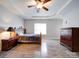 Spacious bedroom with wood flooring, ceiling fan, and dresser at 104 Aberdeen Dr, Troutman, NC 28166