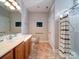 Main bathroom with double vanity and shower/tub combo at 104 Aberdeen Dr, Troutman, NC 28166