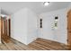 Bright entryway with wood-look floors and white walls at 2275 Lipe Rd, China Grove, NC 28023