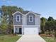 Two-story house, gray and light blue siding, two-car garage at 1276 31St Ne St, Conover, NC 28613