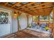 Covered porch with wooden seating and fall decor at 120 Forest St, Rockwell, NC 28138