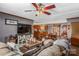 Spacious living room with open concept floor plan and a large TV at 120 Forest St, Rockwell, NC 28138