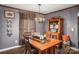 Farmhouse style dining room with a wooden table and hutch at 120 Forest St, Rockwell, NC 28138