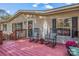 Mobile home exterior with a welcoming front porch and rocking chairs at 120 Forest St, Rockwell, NC 28138