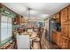 Open kitchen with island and dining area, lots of wooden cabinets at 120 Forest St, Rockwell, NC 28138