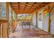 Covered porch with wooden seating and fall decor at 120 Forest St, Rockwell, NC 28138