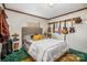 Bedroom with a double bed, guitar wall mounts, and nightstand at 120 Forest St, Rockwell, NC 28138