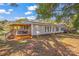 Mobile home with a large yard and a covered porch at 120 Forest St, Rockwell, NC 28138