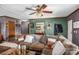 Living room with a sectional sofa, green accent wall, and wood floors at 120 Forest St, Rockwell, NC 28138