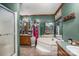 Bathroom with corner bathtub, wooden vanity, and shower at 120 Forest St, Rockwell, NC 28138