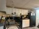 Kitchen with white cabinets and black appliances at 1926 Scenic Dr, Iron Station, NC 28080